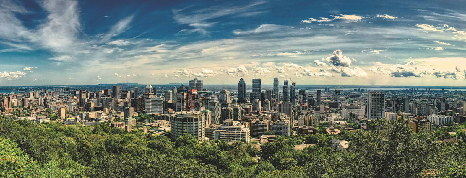 Montreal skyline with Mount Royal cross visible at twilight
